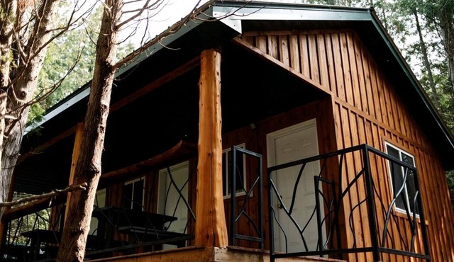 Lakeside Group Cabin with Huge Deck, Fire Pits & Sunset Views in Ontario, Canada in Roseneath
