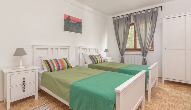 Room with two single beds in Koper